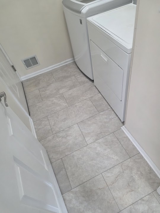 Light rectangular flooring in a laundry room